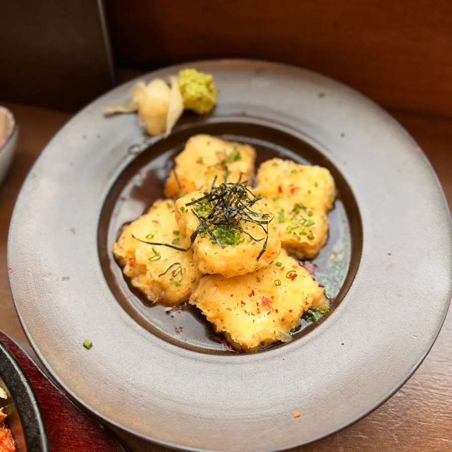 Agedashi tofu sitting in tsuyu sauce