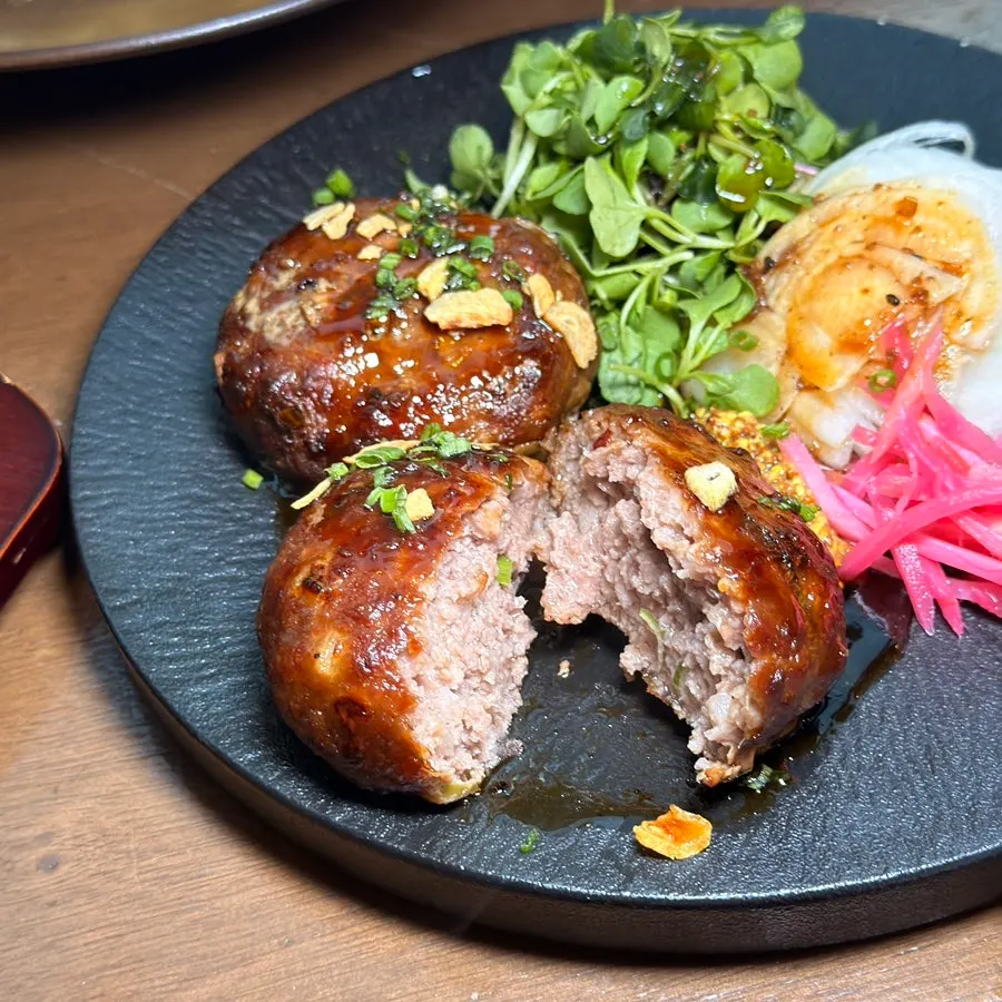 Cross-section of tteokgalbi showing sauce-soaked meat texture