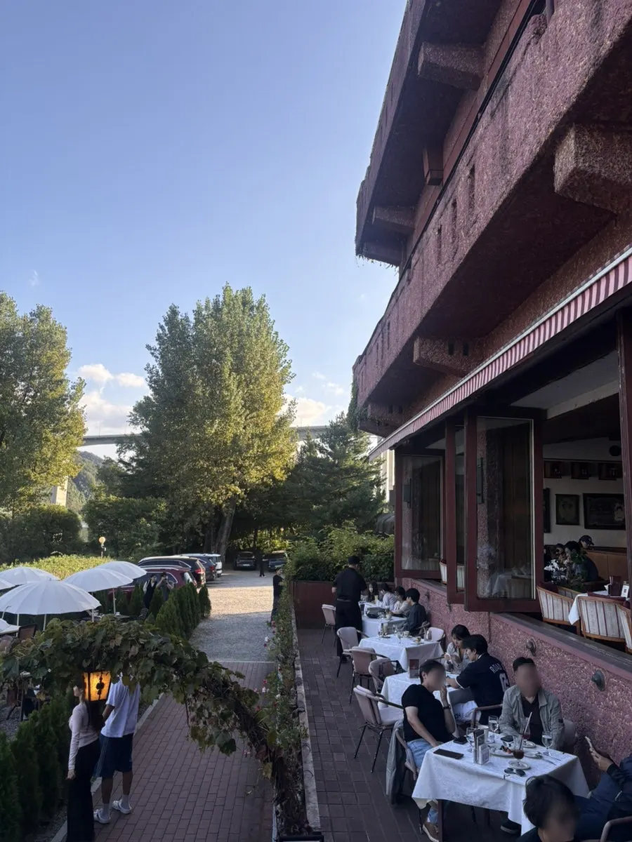 Window view of the Bukhan River café at sunset
