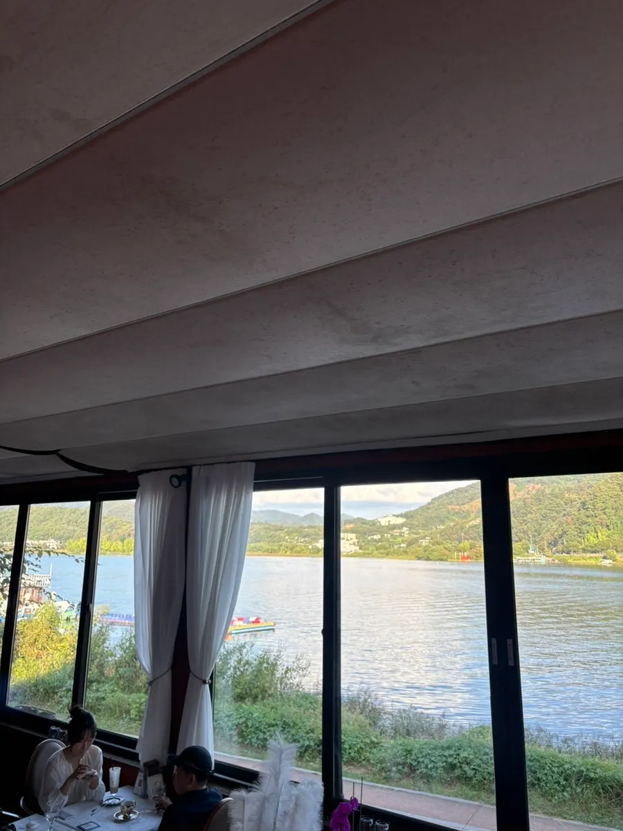 Evening sky over the Bukhan River through the café window