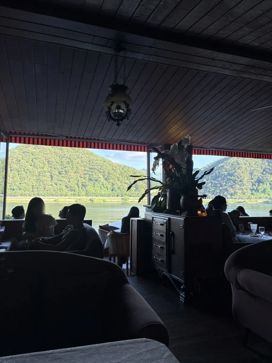 Café interior window seating with a river view