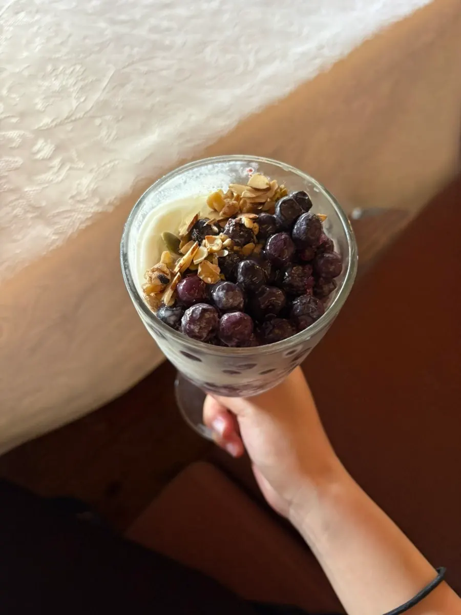 Blueberry yogurt and coffee on the table
