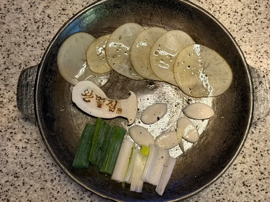 Potatoes, mushrooms, rice cake, and green onion grilling first