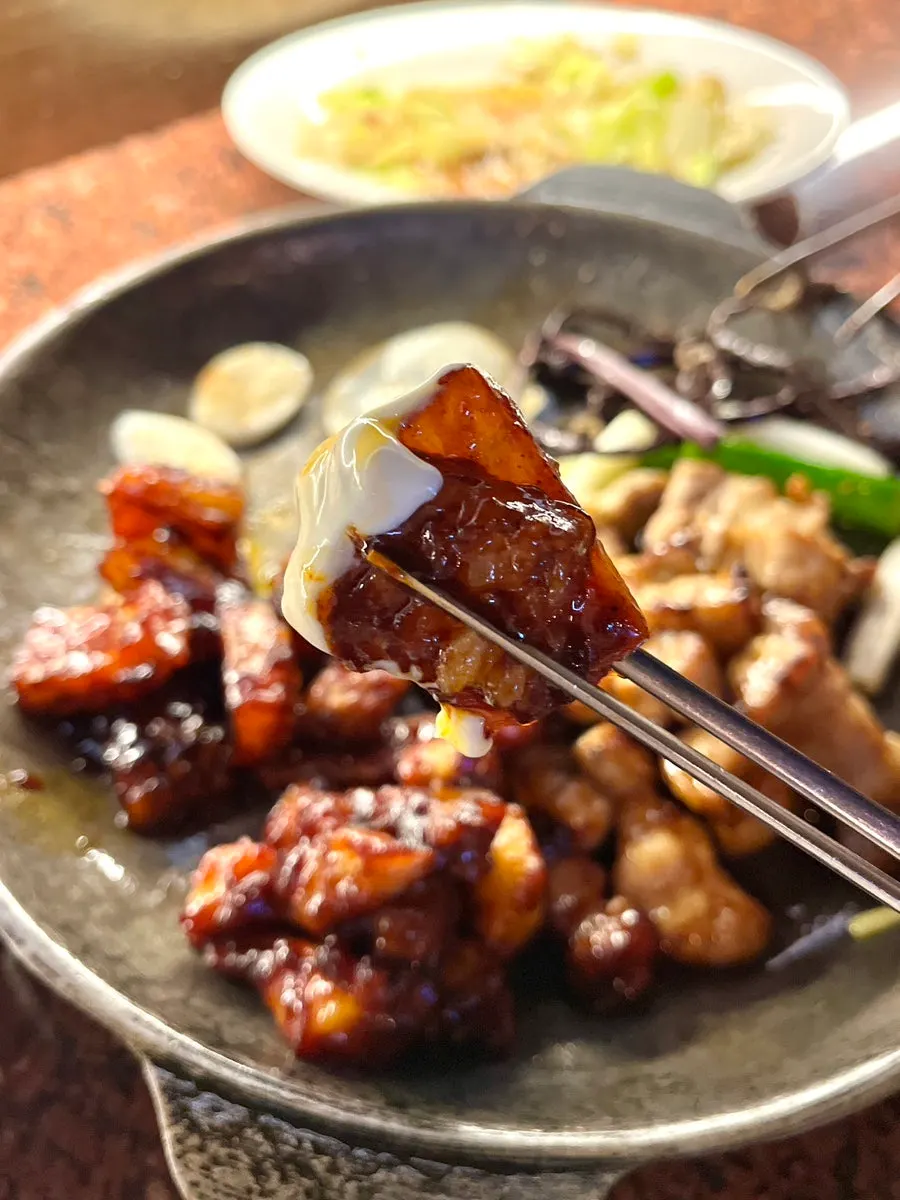 Pork belly enjoyed with various accompaniments