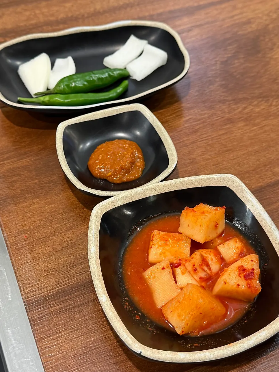 Menu board listing gamjatang and bone-in stew