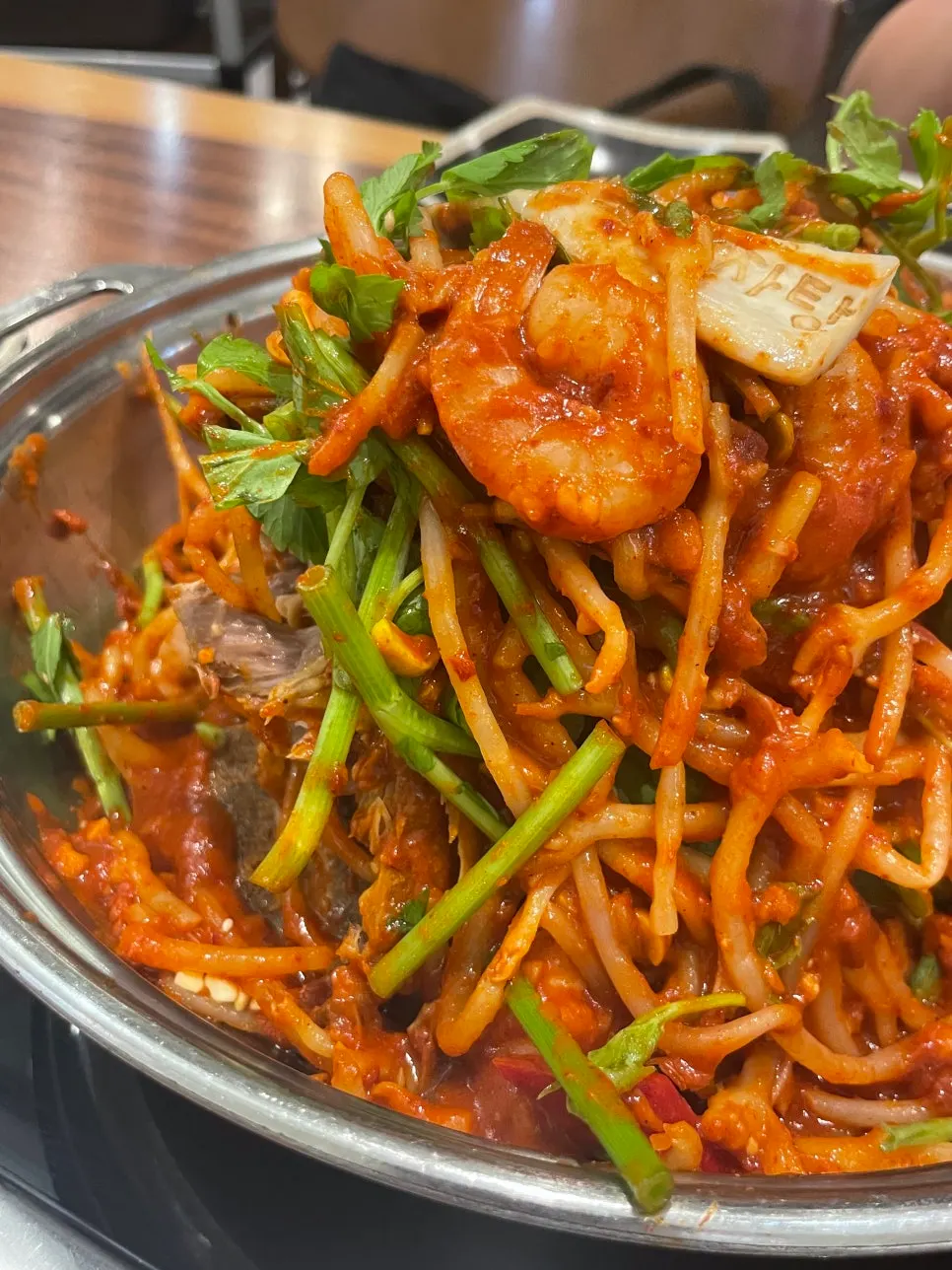 Plump whole shrimp inside the bone-in stew