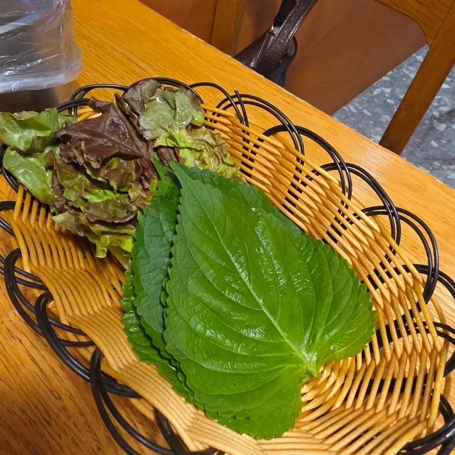A plate of lettuce wraps served alongside the meal