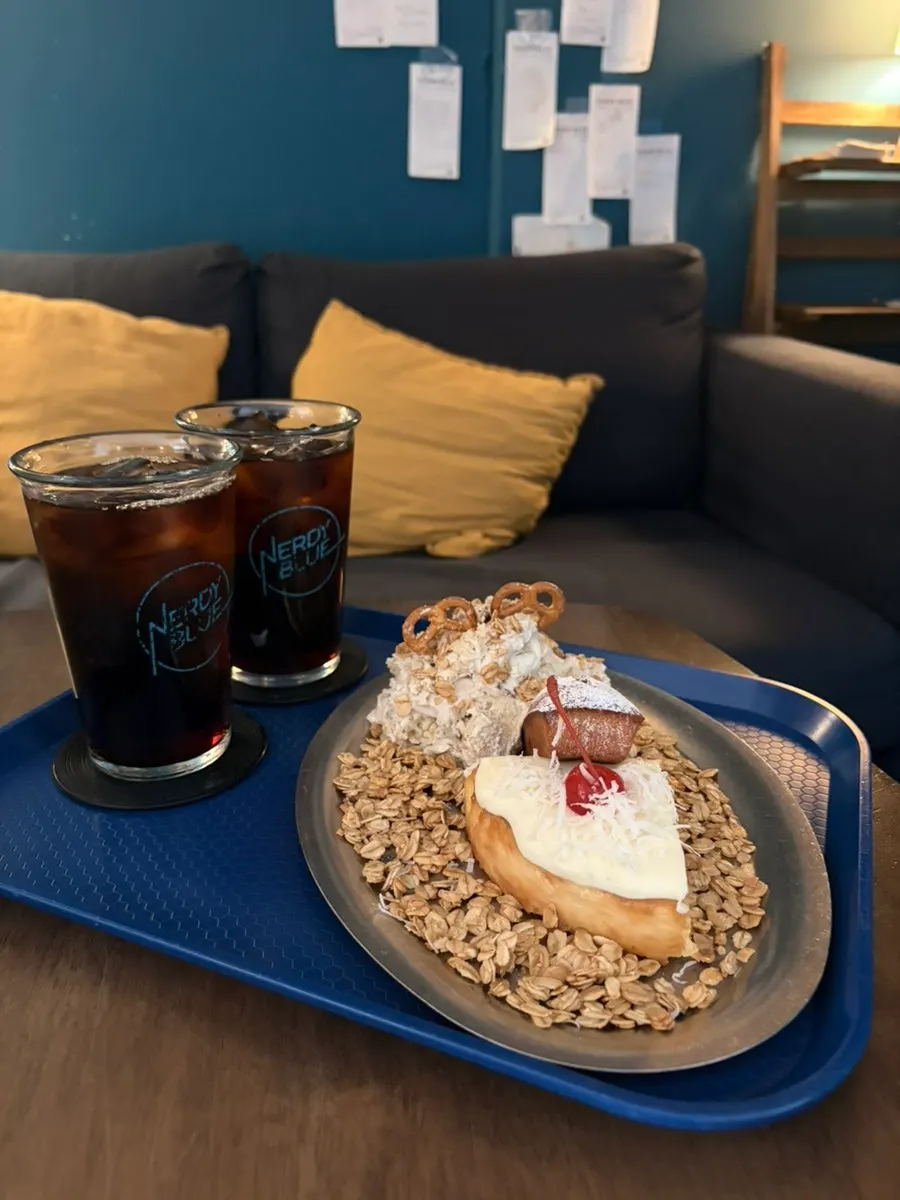 Two cold brews with three desserts on the plate