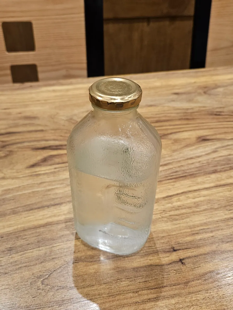 Geumnyeong Gomtang's glass water bottle resembling an old-school juice bottle