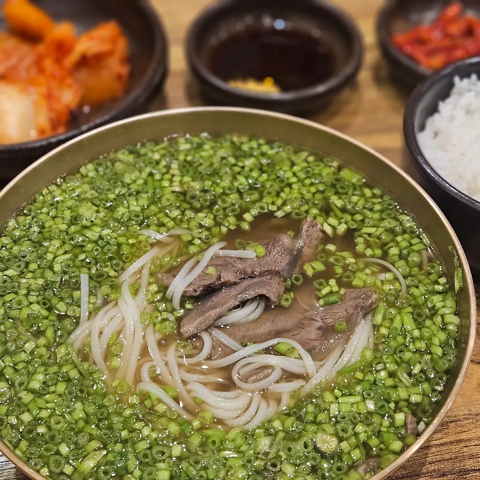 Rice bowl served alongside the minari rice noodle soup