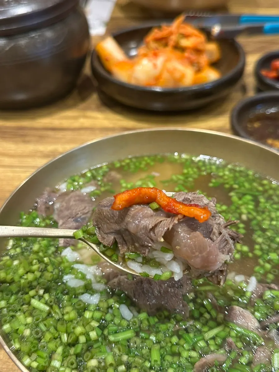 Broth and minari in the minari gomtang