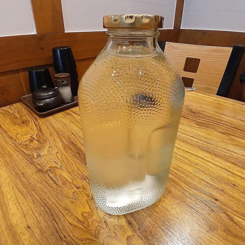 Water served in a Family Juice bottle