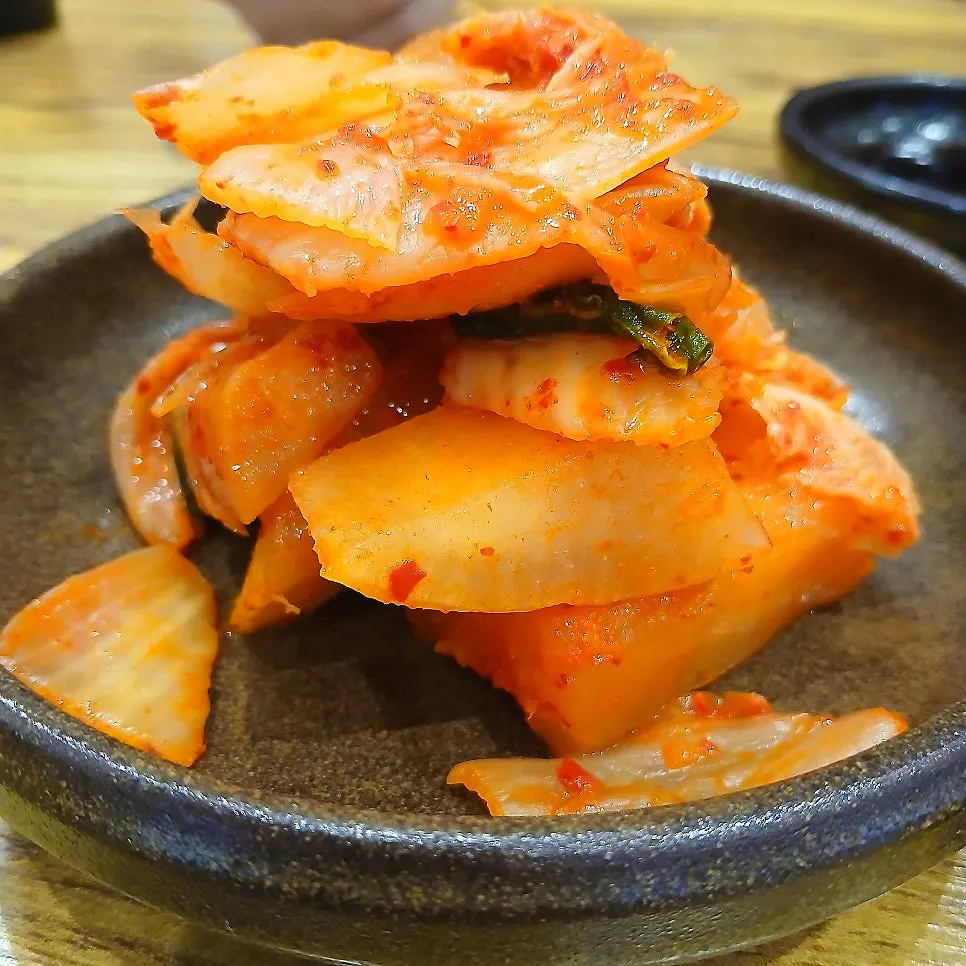 Kimchi served in a jar at the gomtang restaurant