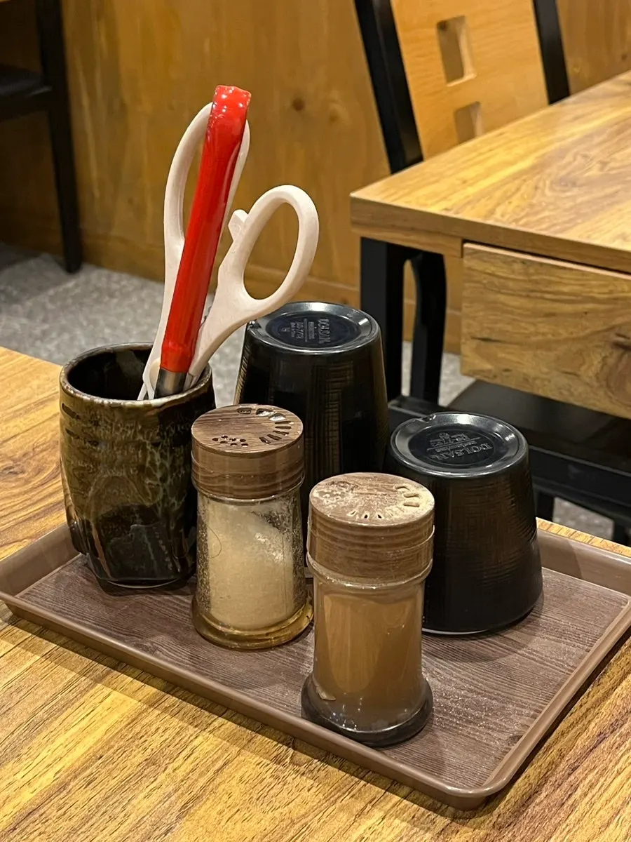 Bottled water and cups served at Geumnyeong Gomtang
