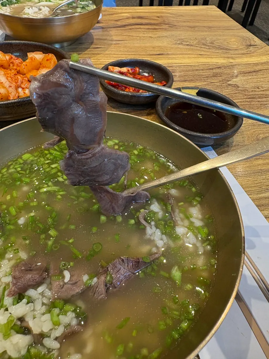 A look inside the gomtang bowl showing the rice