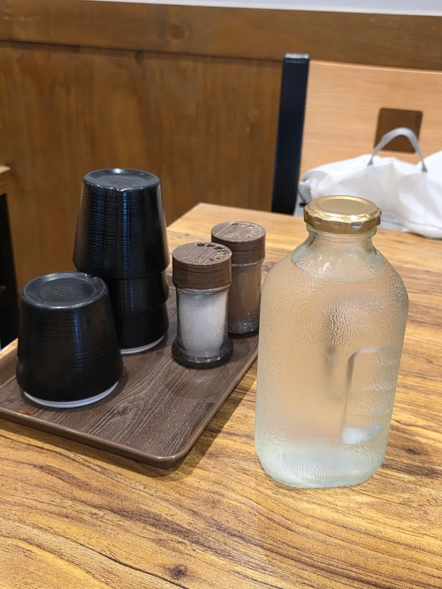 Water served in a mini Del Monte bottle