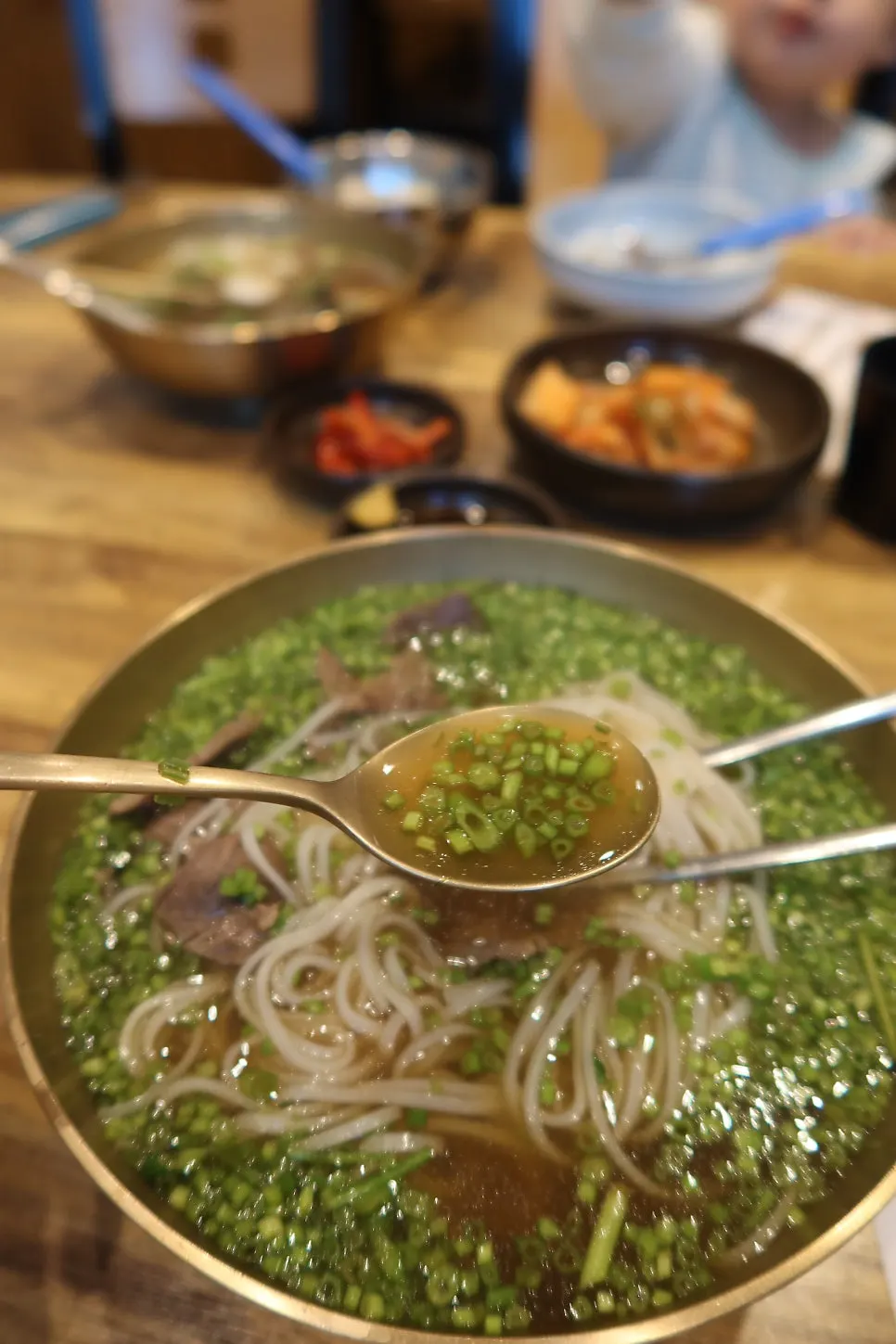 A spoonful of 1++ Korean beef gomtang broth