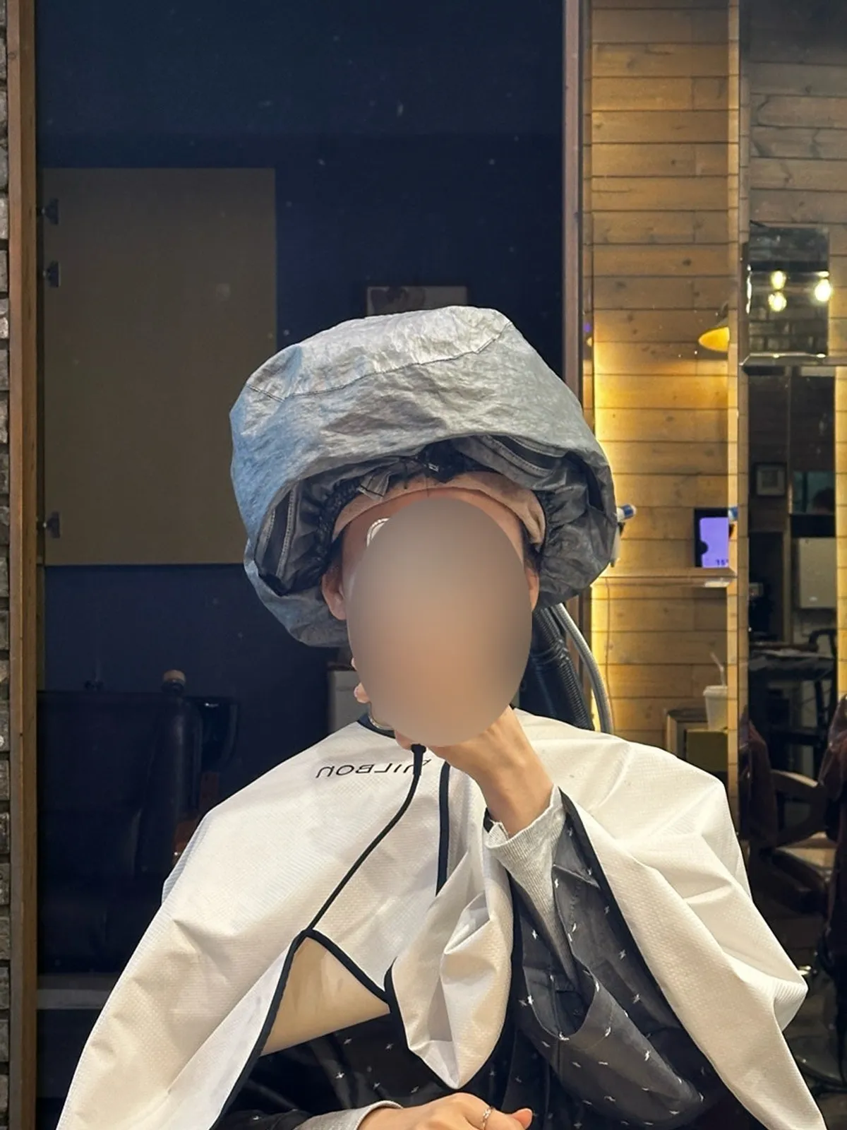 Steam mist treatment sprayed over all of the hair