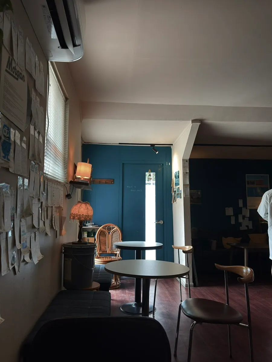 Dimly lit interior of Nerdy Blue Burrow café