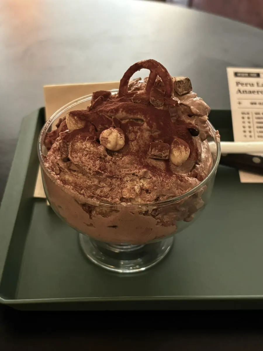 Chocolate pudding and iced coffee of the month served together