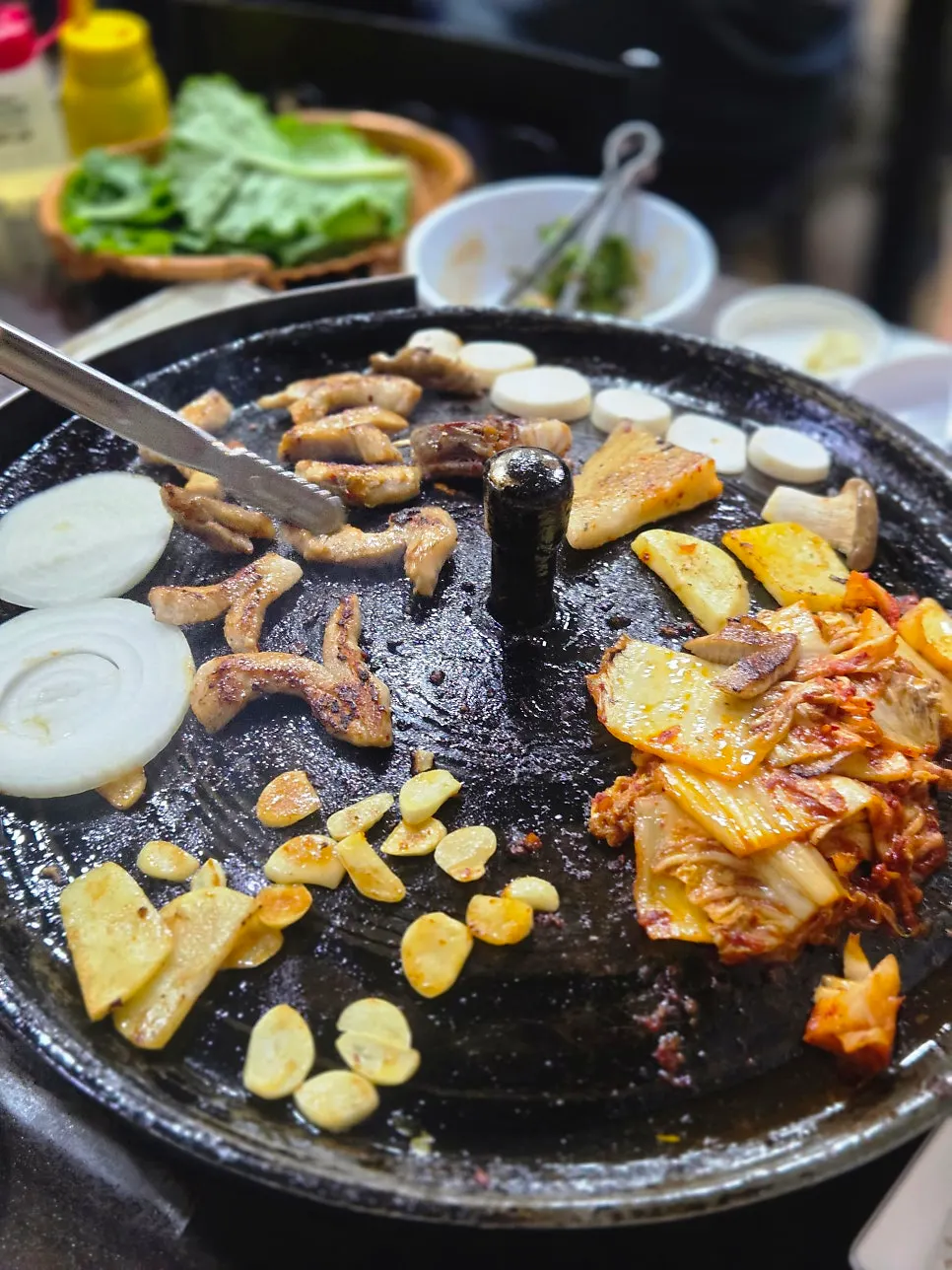 Potatoes and pork belly cooking in pork fat
