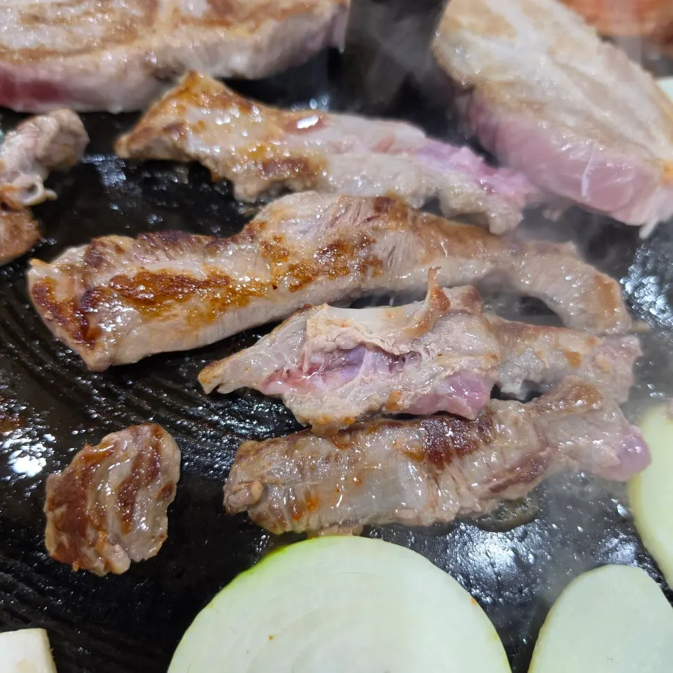 Pork jowl grilling to a golden brown