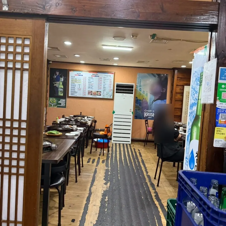 Sign noting unlimited stew and naengmyeon