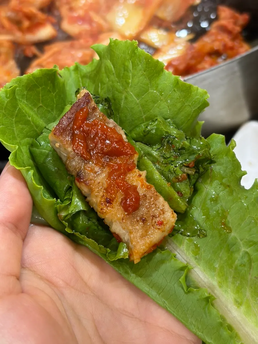 Close-up of golden-brown grilled pork belly