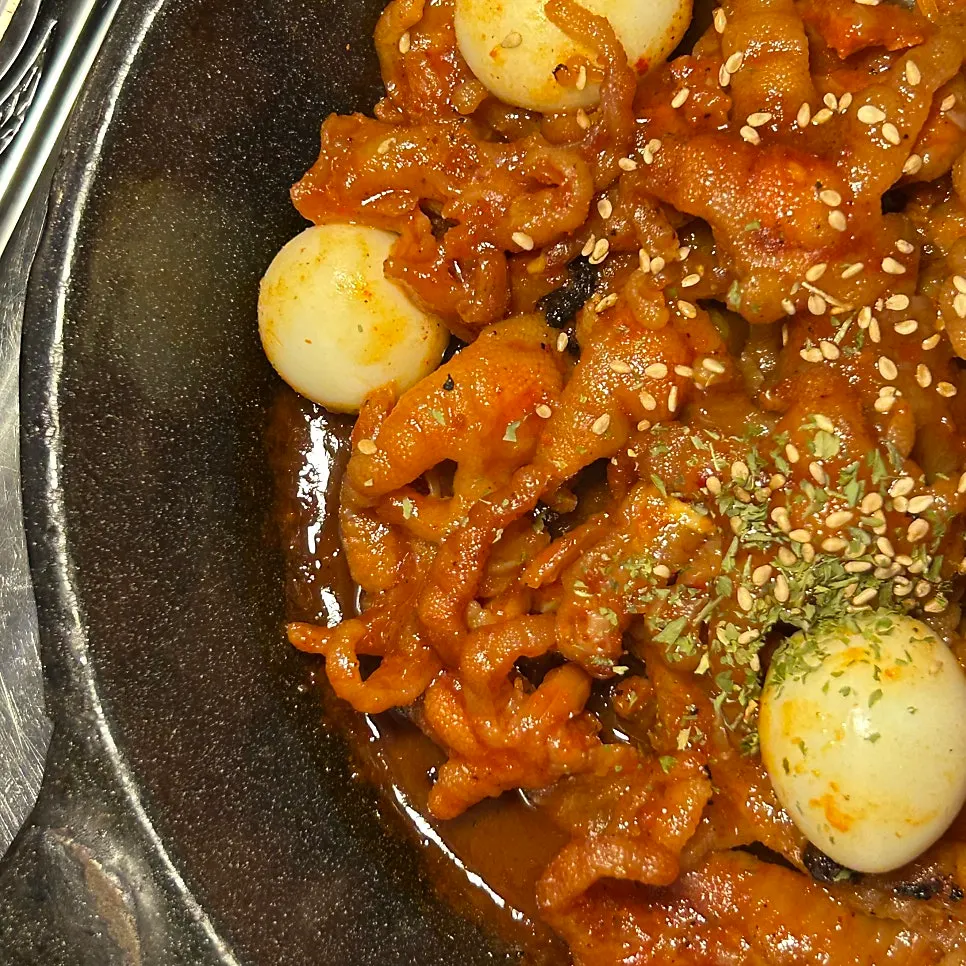 Close-up of sauce-coated boneless chicken feet