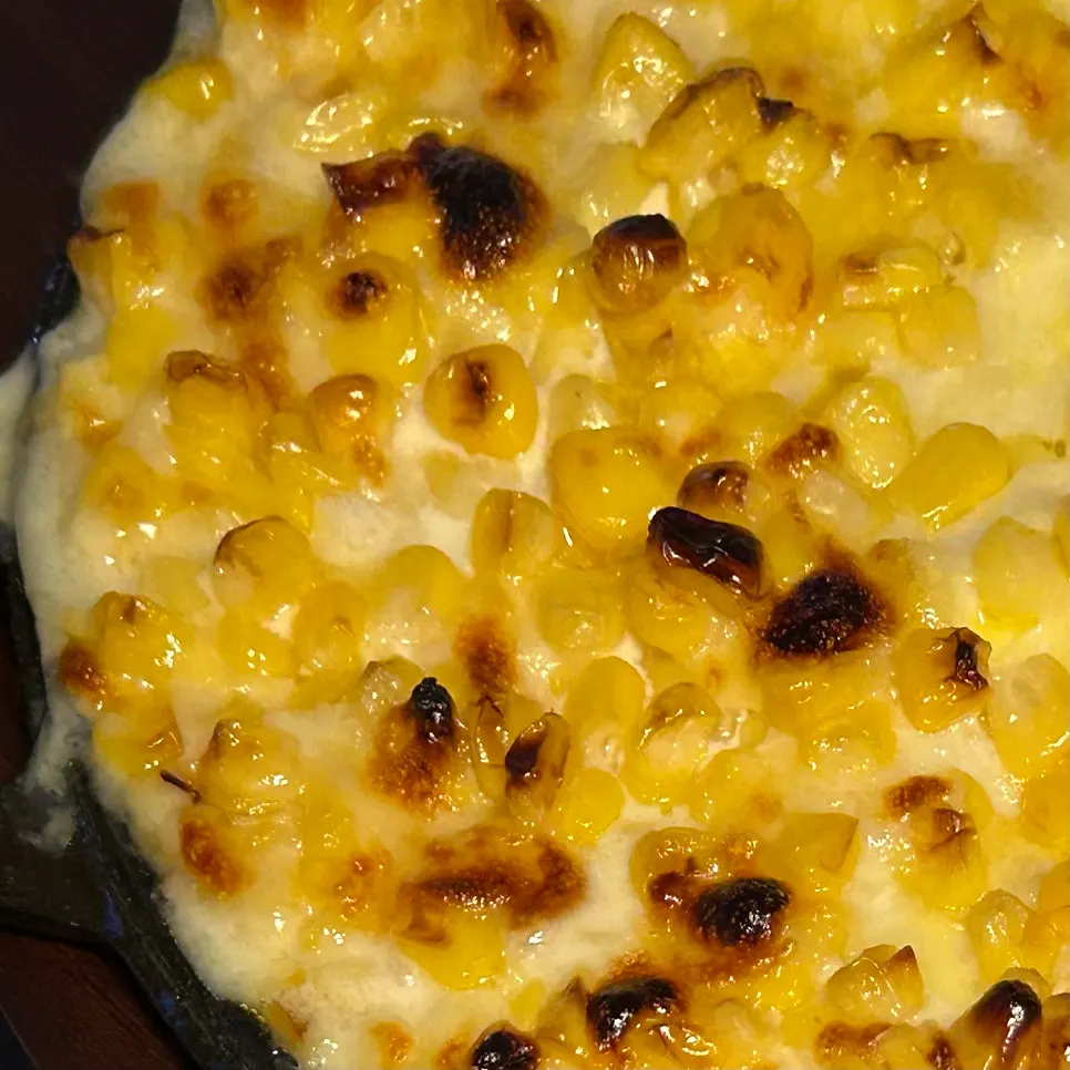 A cheese-stretching spoonful of corn cheese