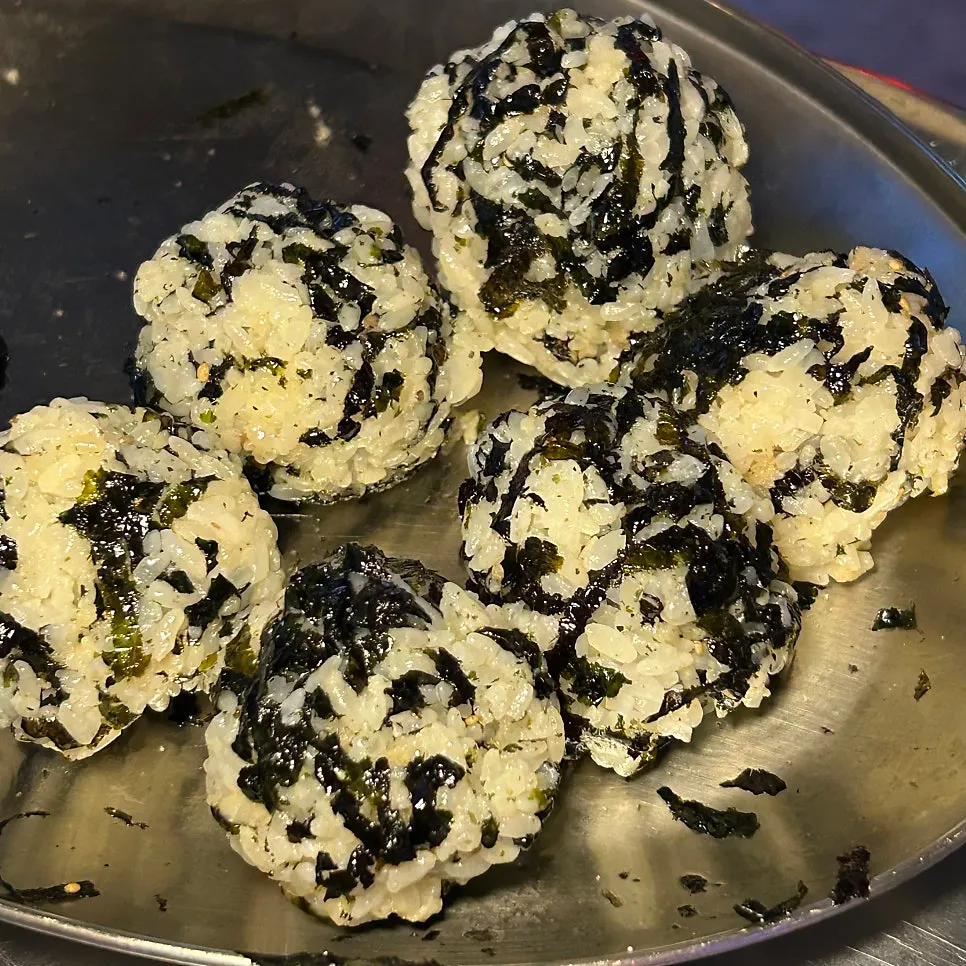 Self-made rice ball mixed with seaweed flakes