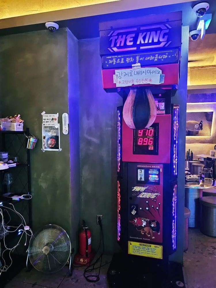 A large arcade-style game machine inside the venue