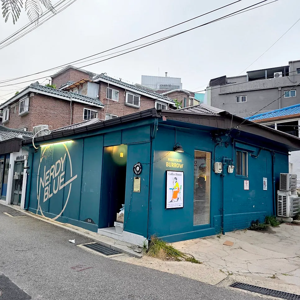 Teal café exterior remodeled from a house