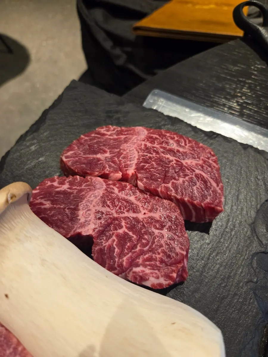 Staff grilling meat at Yukseong