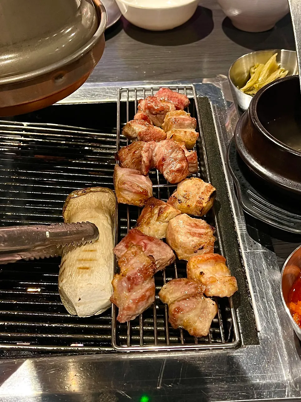 Staff grilling pork at Yukseong