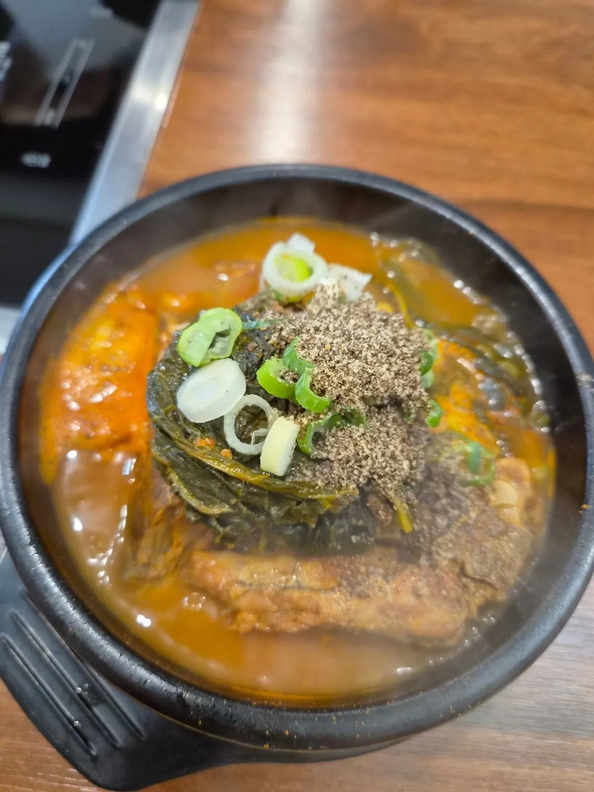 Bone soup bubbling in a stone pot