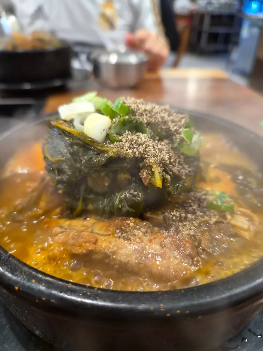 Bone soup topped generously with ground perilla seeds