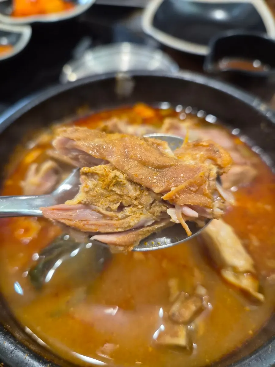 Bone soup served with a bowl of rice