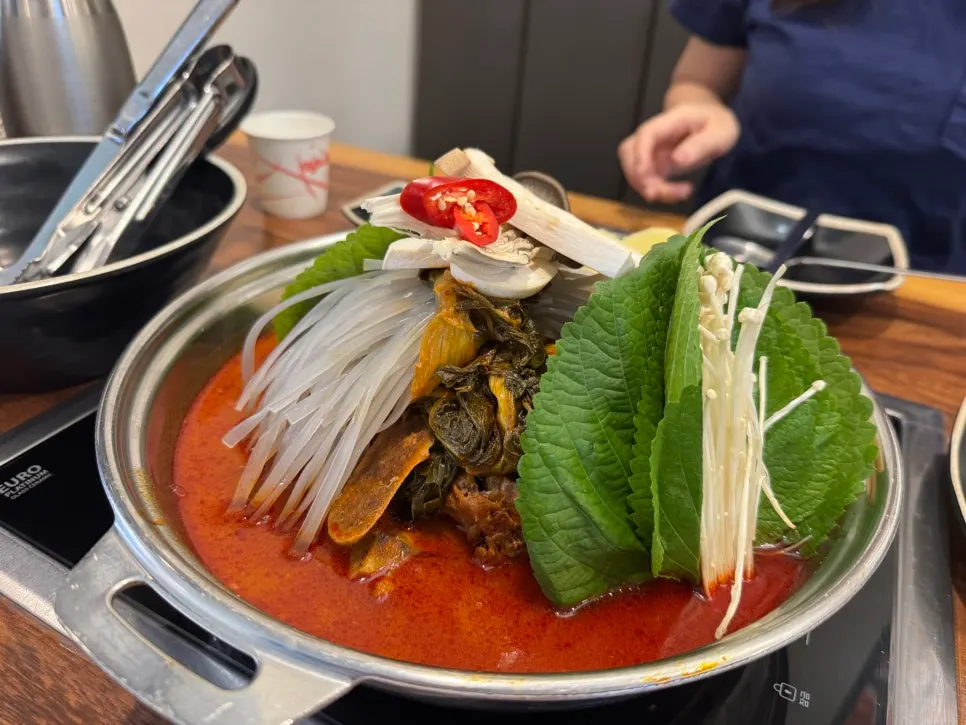A spoonful of hot gamjatang broth