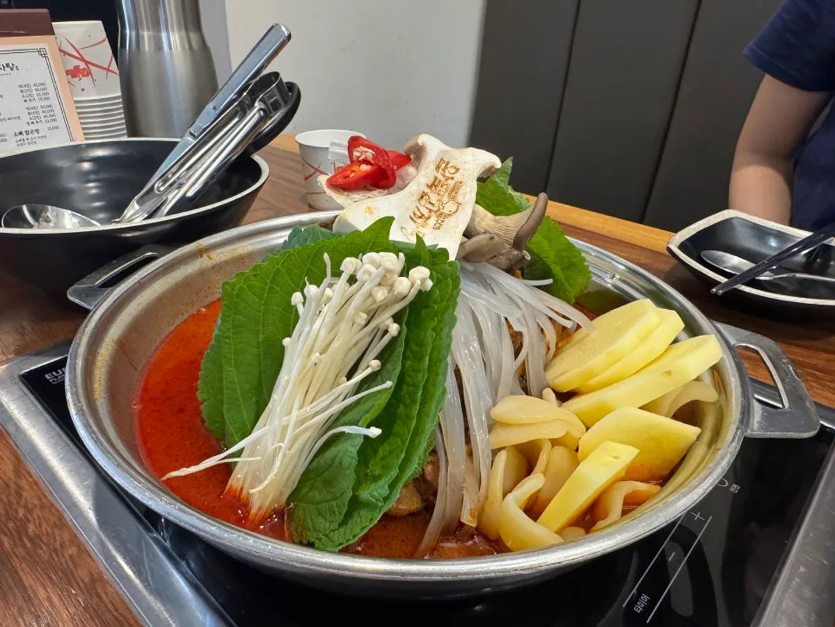 Fluffy potato and mushrooms scooped out of the pot
