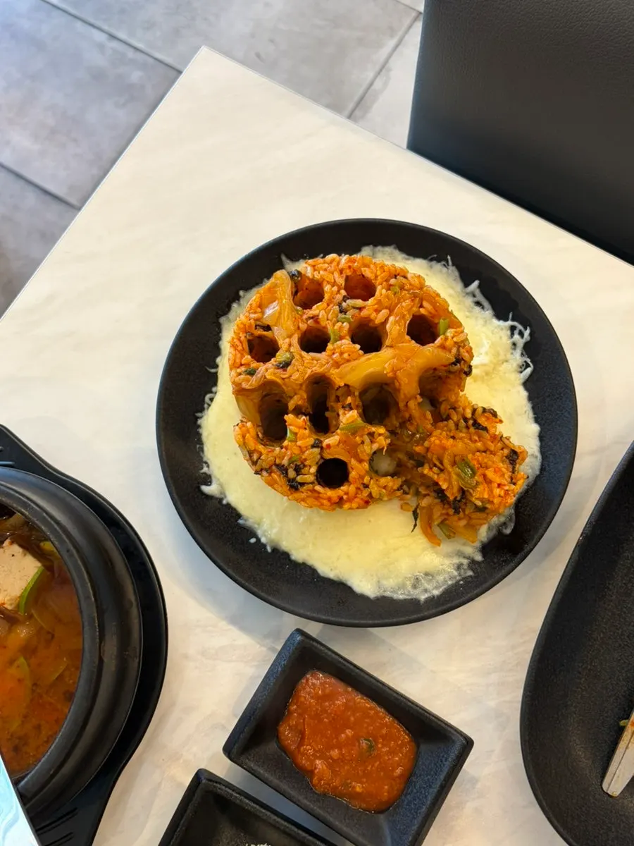 Charcoal-shaped cheese fried rice served on a plate