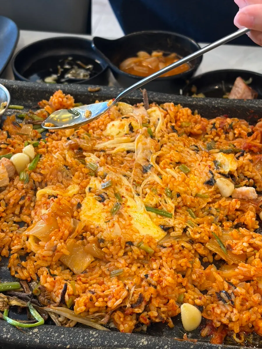 Cheese charcoal fried rice placed on the stone plate