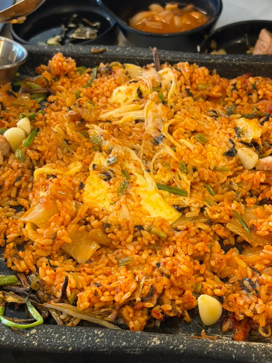 Stretchy cheese fried rice mixed with leftover meat