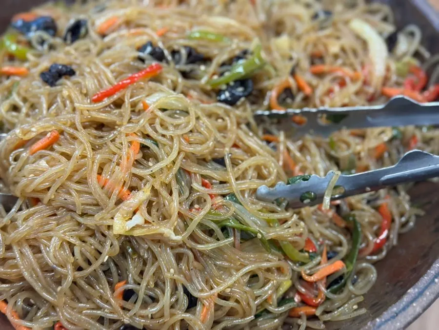 Buffet corner with japchae, pumpkin pancakes, and fried dishes