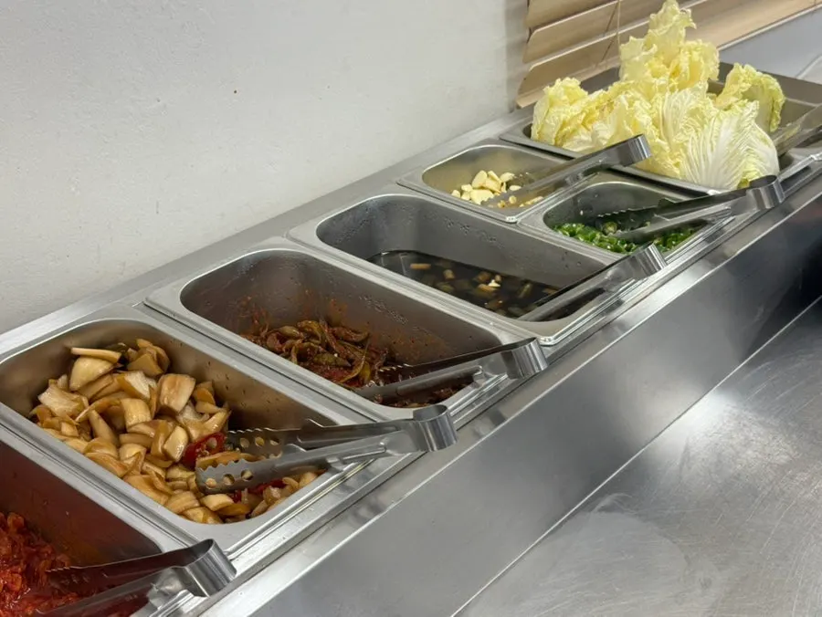 A full Korean buffet meal with rice and soup