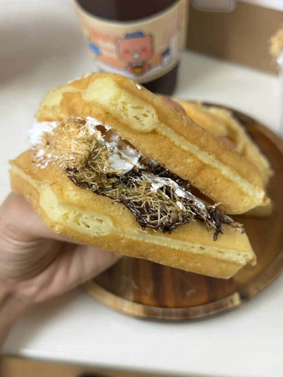 A waffle piece generously spread with kadayif