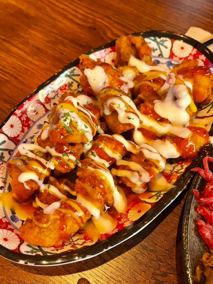 Close-up of the heavily sauced Jonggatjip yangnyeom boneless fried chicken