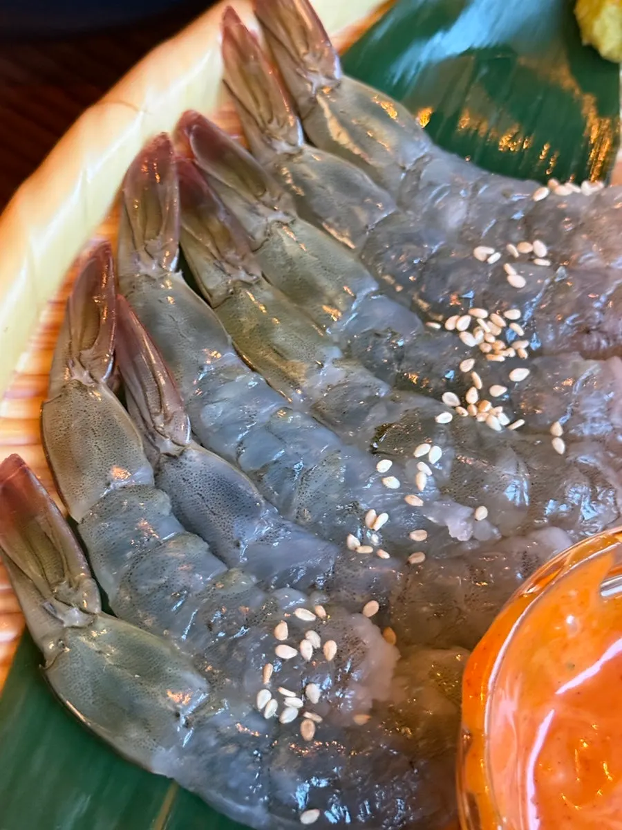 Raw shrimp sashimi dipped in buldak mayo sauce
