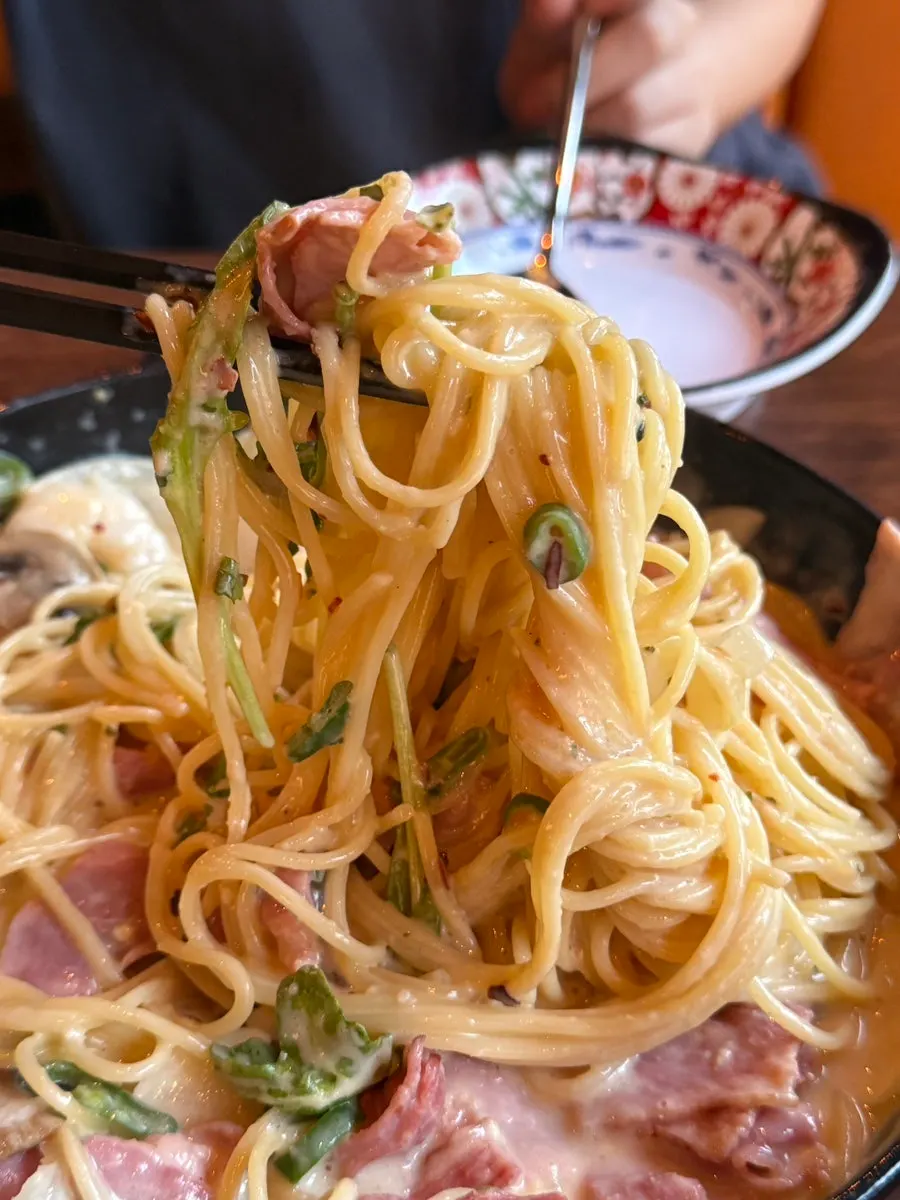 Noodles of the myeongran cheongyang cream pasta lifted with a fork