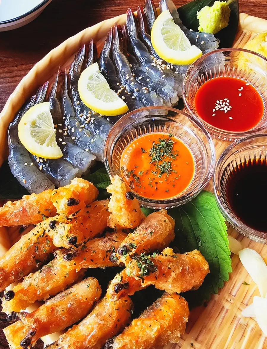 Crispy fried shrimp heads served alongside the sashimi